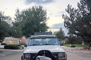 Front face of jeep, with sinking hood, causing rub and coils to be pressed in all the way.