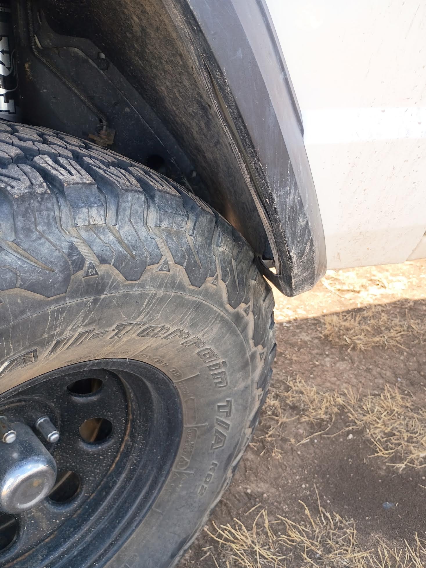 Tire rubbing up against fender, coils were all the way down since the lift was a lot shorter than intended.